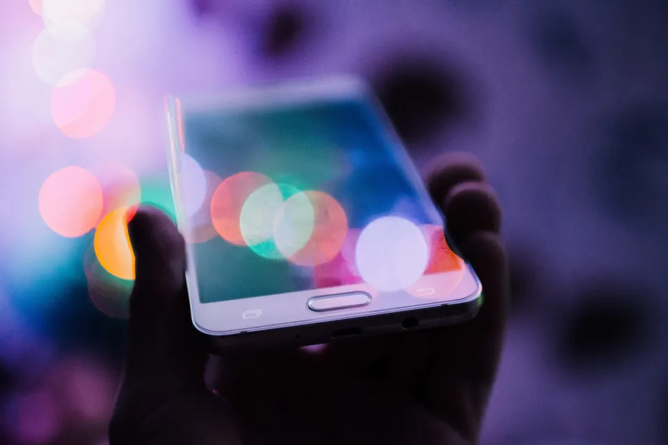 Doctor using smartphone to manage online reputation and reviews — digital health marketing concept