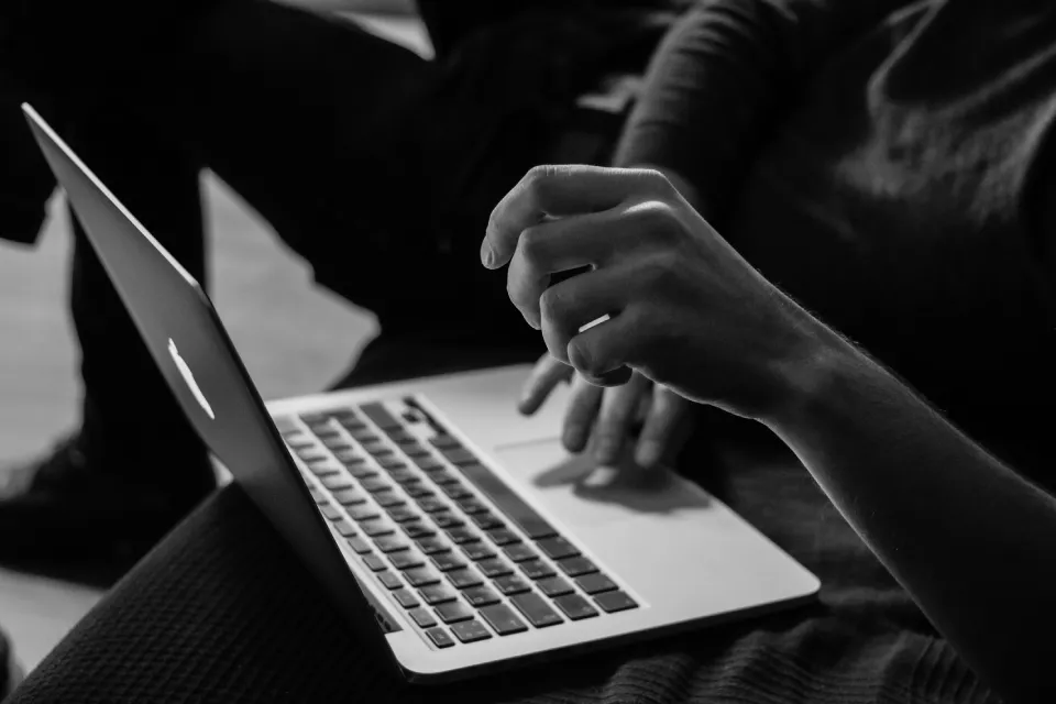 Healthcare professional managing Google Business Profile and patient reviews from a laptop